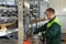 A worker drives a forklift in the warehouse