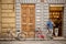 Worker eating his lunch leaning against the wall outside a bakery in Florence