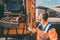 Worker emptying dustbin into waste vehicle