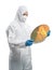 Worker or engineer wears medical protective suit or white coverall suit with silicon wafer