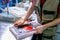 A worker extract the plastic detail from the mold. Manufacturing of plastic products. Medium business concept. Hands close-up