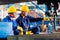 Worker in factory at industrial metal cutting machine