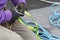 Worker fixes a rope and climbing equipment before descending from the roof. High-altitude works.