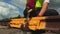 Worker fixing nut with wrench on railway