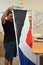 Worker fold the Red Peak flag