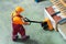 Worker with fork pallet truck