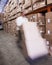 Worker with fork pallet truck stacker in warehouse