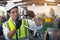 A worker in glasses standing near industrial equipment and verifies production. man operating machine in the factory