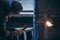 A worker in goggles processes granite with gas welding.