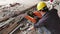 A worker grinding metal angle iron with sparks flying