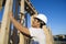 Worker Hammering Nail On Wooden Wall