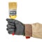Worker hand in black protective glove and brown uniform with unused construction paintbrush close-up isolated on white background