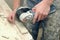 Worker hands cutting a tile