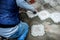 Worker hands marking concrete tile to be cut