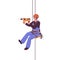 Worker hanging on ropes with drill tool. Industrial alpinist climber suspended on safety harness with equipment for