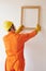 Worker Hanging Wooden Frame