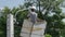 Worker on height lifting platform installing new street light bulb