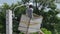 Worker on height lifting platform installing new street light bulb