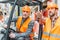 worker and his senior colleague working with forklift machine