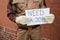 Worker holding placard with the text need a job