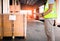 Worker Holds a Clipboard Checking the Loading Cargo Shipment at Distribution Warehouse. Package Boxes Supplies Warehouse.