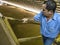 Worker inside a grain storage silo