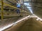 Worker inside a grain storage silo filled with soybean seeds