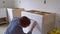 Worker installing kitchen cupboard