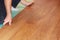 Worker installing new laminate flooring