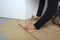 Worker installing wood parquet