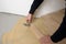 Worker installing wood parquet