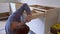 Worker installs drawer to kitchen cabinet construction kitchen
