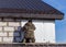 Worker insulates the walls of the house with plastic panels