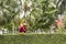 Worker in Kuala Lumpur cutting green fence