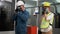Worker Labor man and woman and wearing protection mask face and safety helmet and wearing suit green reflective safety dress in