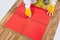 Worker levels crosses Tiles applied on old wooden Floor reinforced net