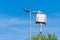 A worker on a lifting tower climbs up to a street lamp