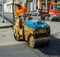 Worker on light vibration roller compactor