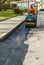 Worker on light vibration roller compactor