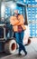 Worker in logistics distribution center with his forklift