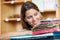 Worker Looking At Colorful Stacked Papers In Shop