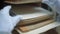 Worker looks through case records lying in box on shelf