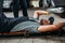 worker lying and working under car