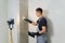 Worker makes final smoothing plaster on the wall.