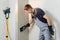 Worker makes final smoothing plaster on the wall.