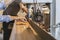 Worker makes holes in a metal beam