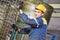 Worker making reinforcement for pipe