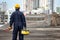 Worker man carrying work tool at construction site