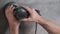 Worker man polishes the plastered wall with an electric hand grinder machine. Master making repair in building.