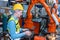 Worker man working with robot arm automate welding machine in modern metal factory. Engineer program robotic in heavy industry